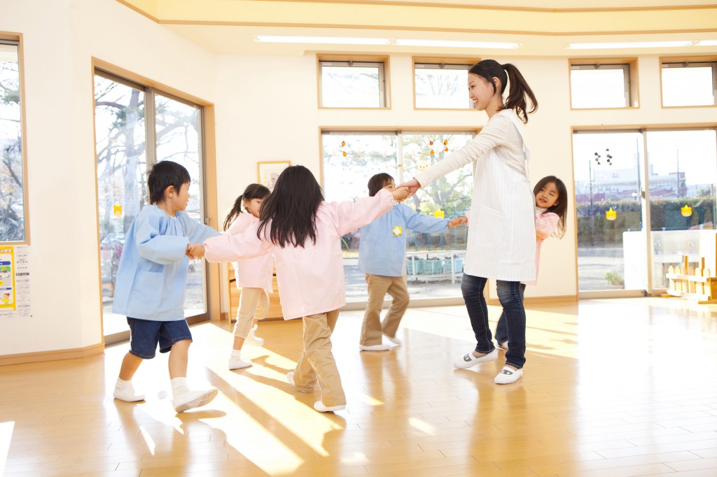 Preschool and kindergarten teachers, dancing in a circle